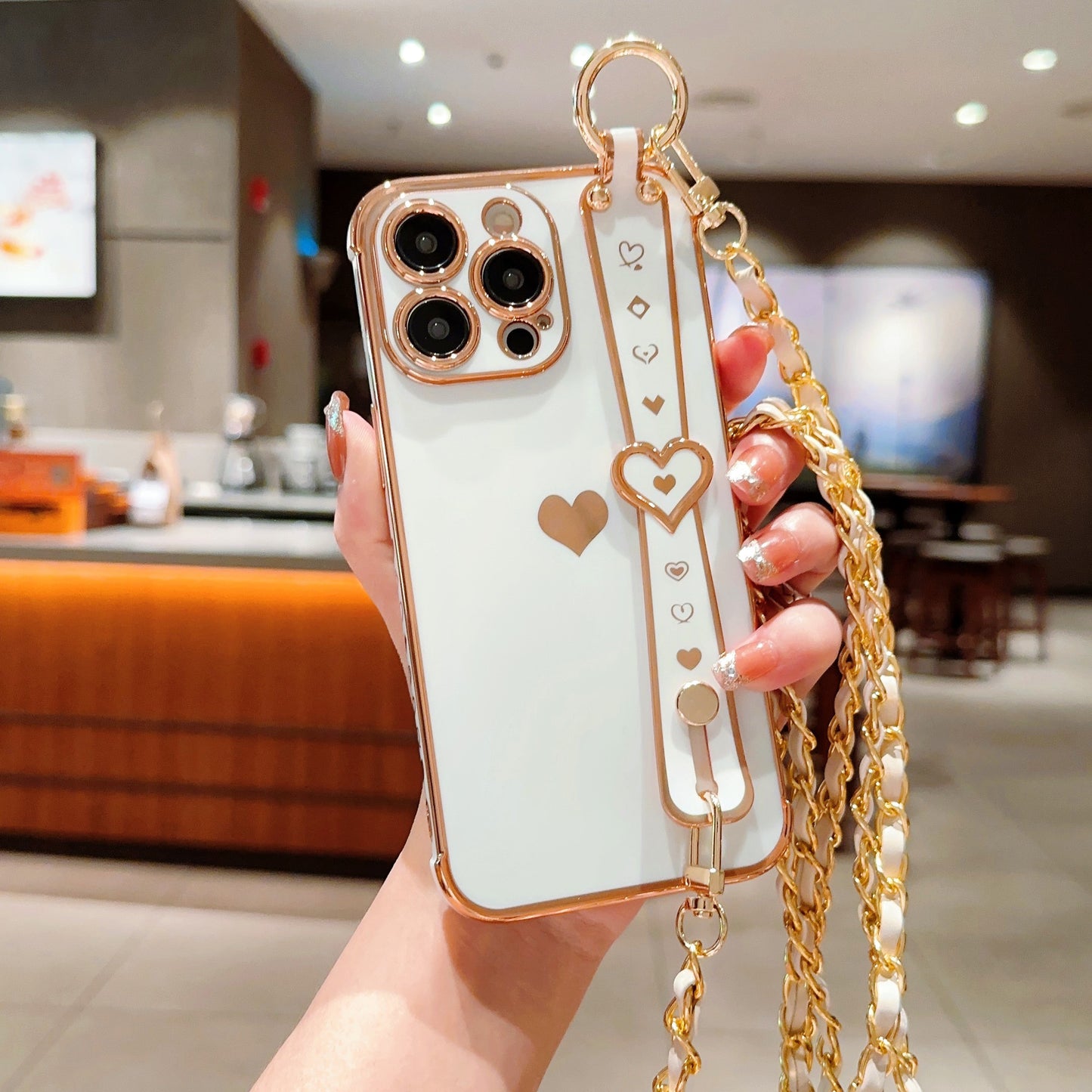 iPhone Phone Case - Dazzling Electroplated Solid Heart Accent, Stylish Heart-Shaped Wristband, Fashionable Diagonal Chain Shoulder Strap - Universally Compatible with iPhone 15, 14, 13, 12, 11 Pro, Promax, and Plus Models