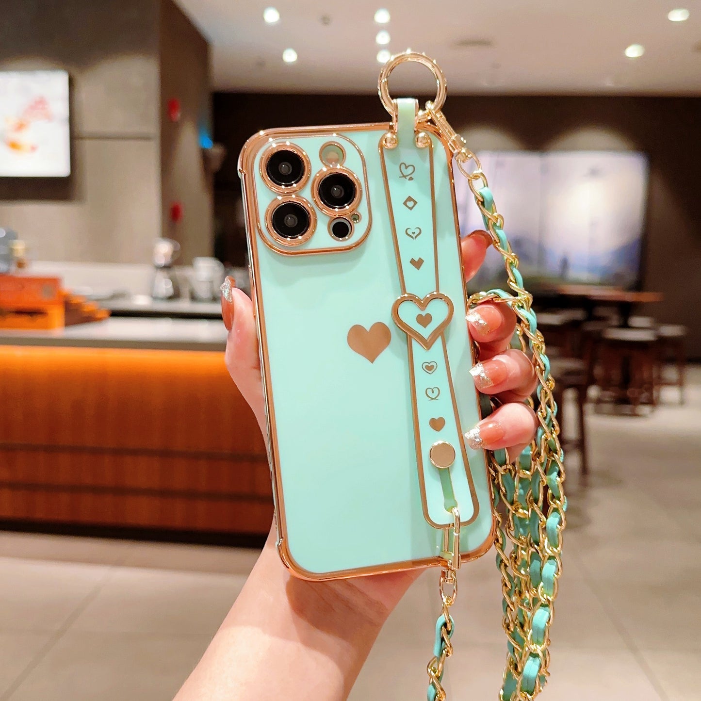 iPhone Phone Case - Dazzling Electroplated Solid Heart Accent, Stylish Heart-Shaped Wristband, Fashionable Diagonal Chain Shoulder Strap - Universally Compatible with iPhone 15, 14, 13, 12, 11 Pro, Promax, and Plus Models