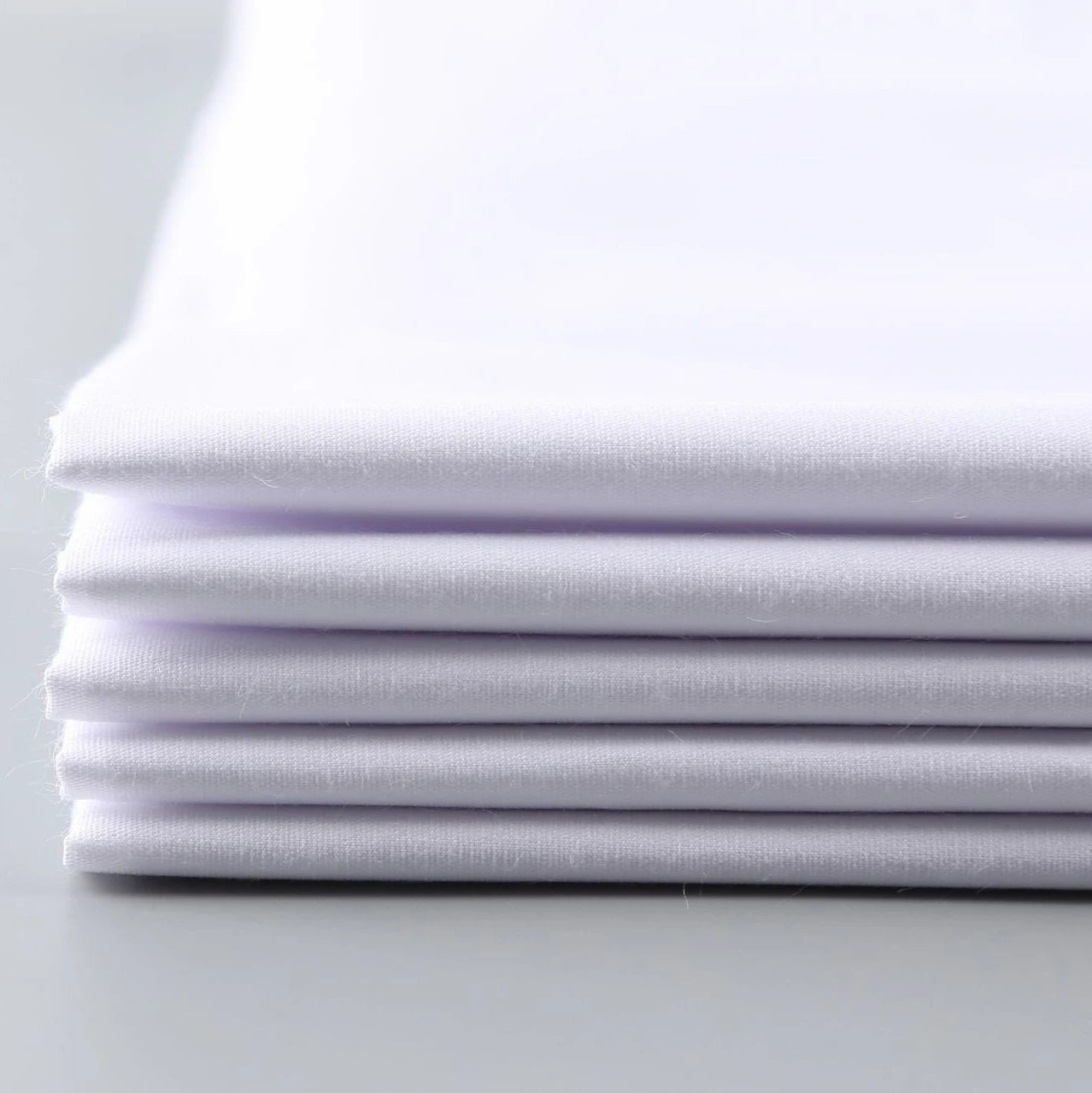 Wholesale Eco-Friendly Crystal White 130gsm 65% Polyester 35% Combed Cotton Poplin Fabric 150cm Woven for School Shirts